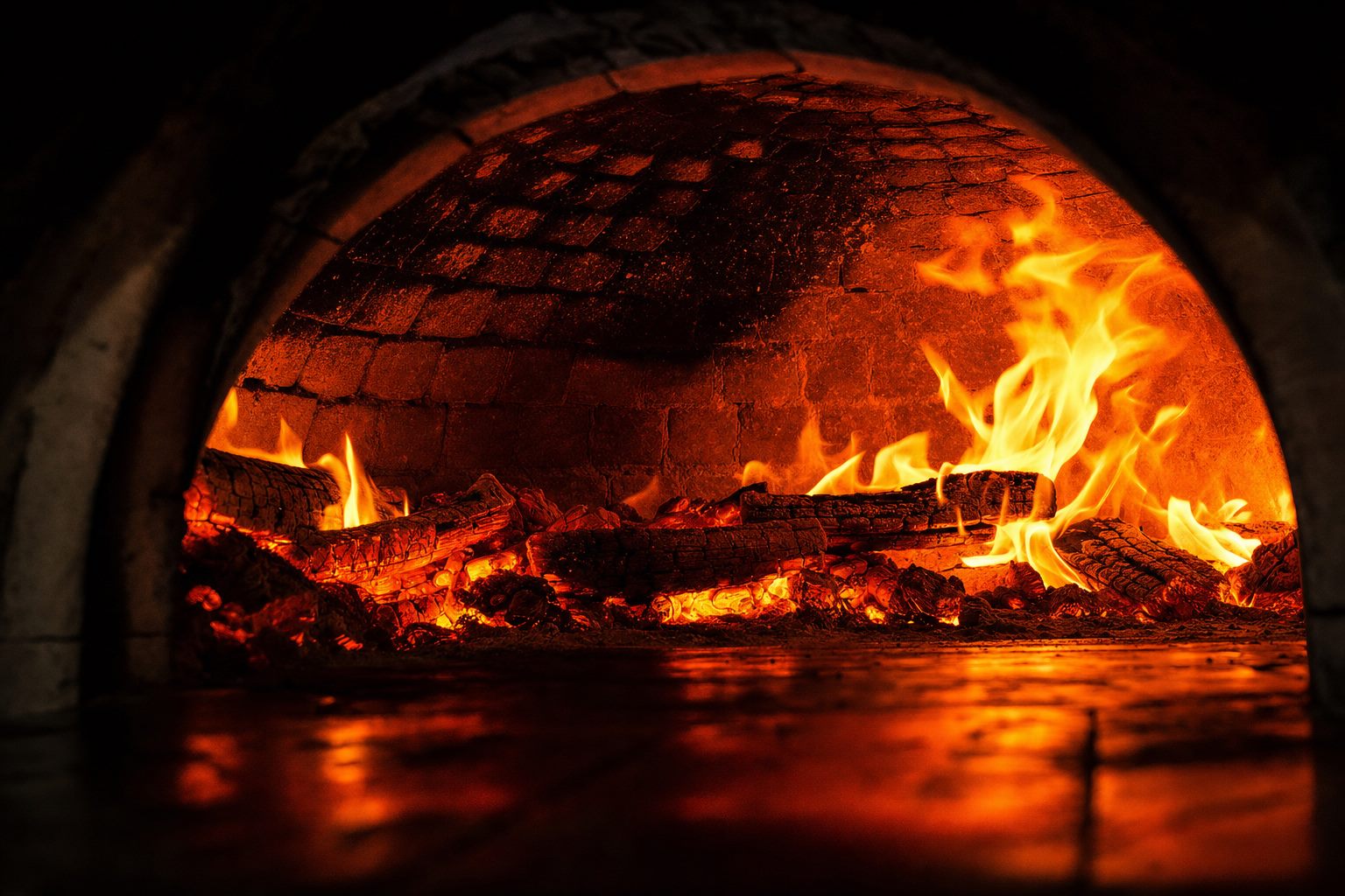 Glowing wood-fired oven with roaring orange flames